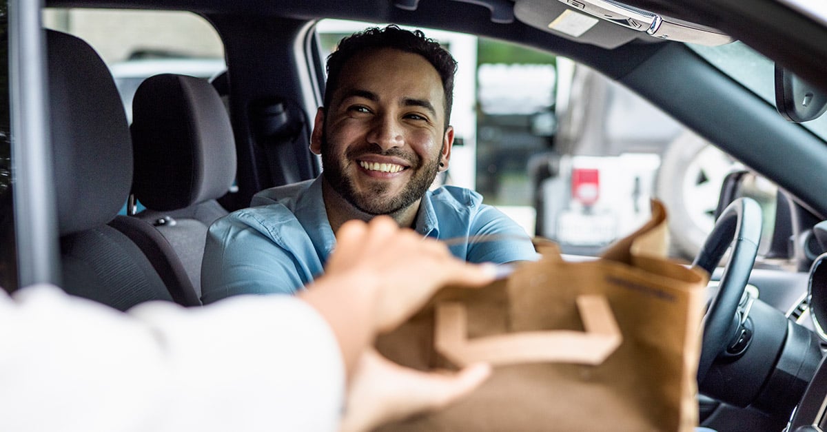 Delivery driver picking up food from a restaurant 