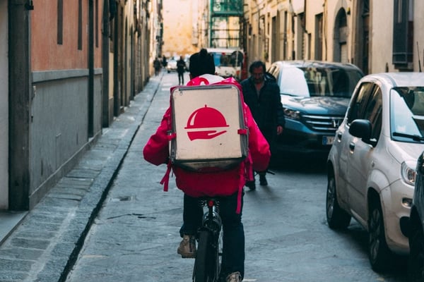 Delivery bike riding down the street