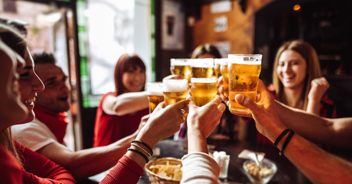 A group of friends enjoying a beer at their local pub over the Melbourne Cup long weekend 