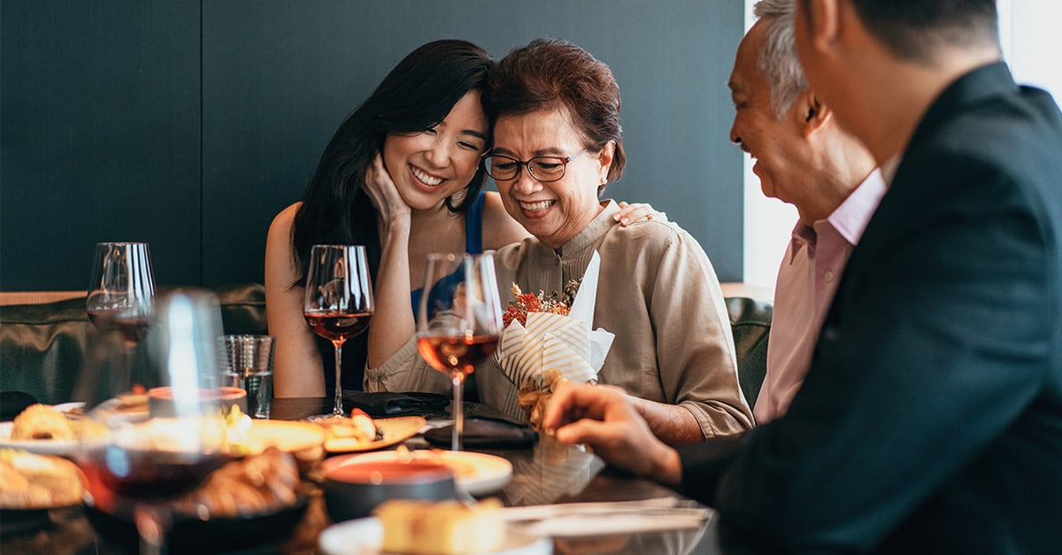 A family enjoying a meal together at a restaurant 