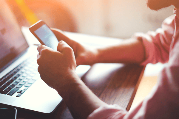 man using his phone to order food online