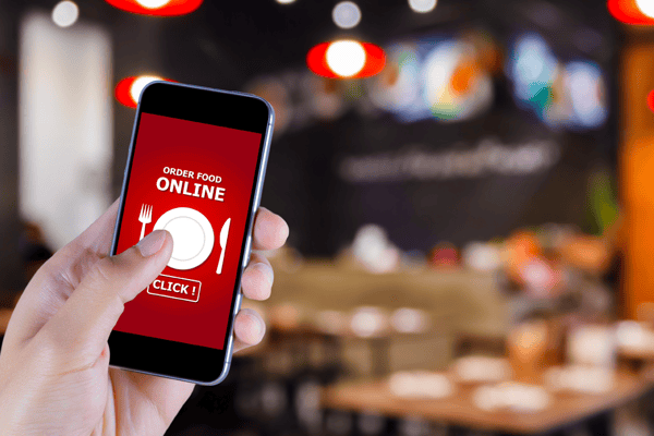 Man using iphone to order food online