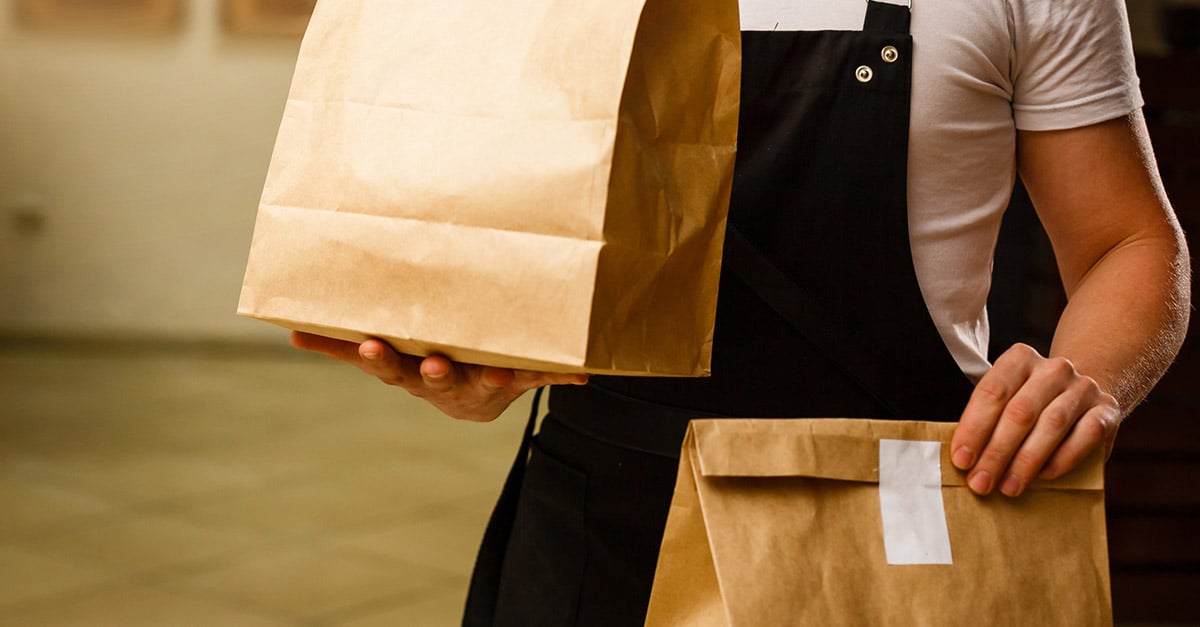 Takeaway food orders with a staff member at a resturaunt