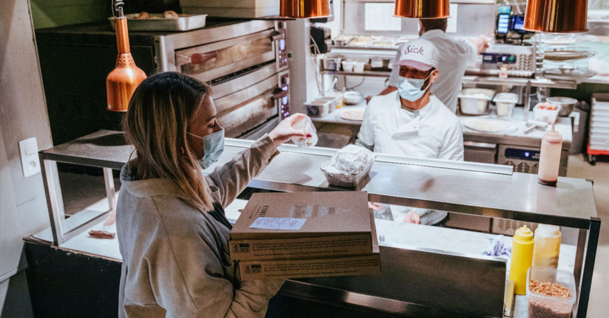 Kitchen preparing home delivery meals for online ordering