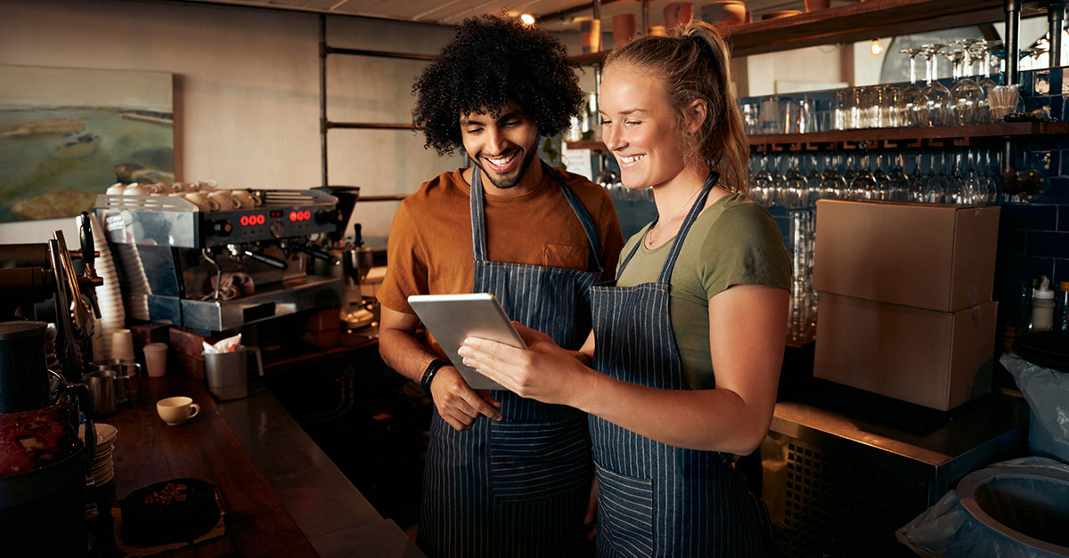 Staff using a tablet in a cafe