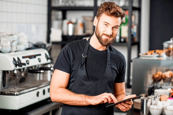 Restaurant staff member using tablet pos