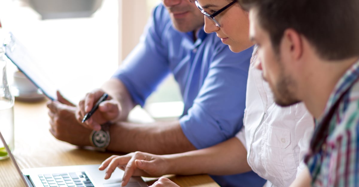 account managers working together on a computer