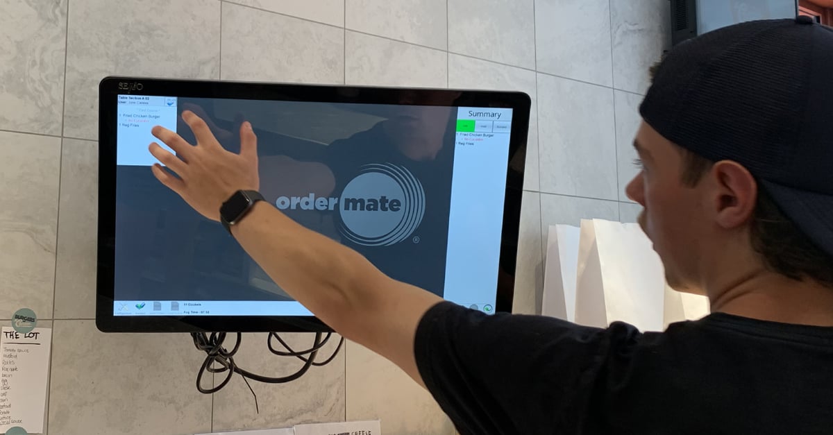 Staff member bumping off an order on their kitchen touch screen system
