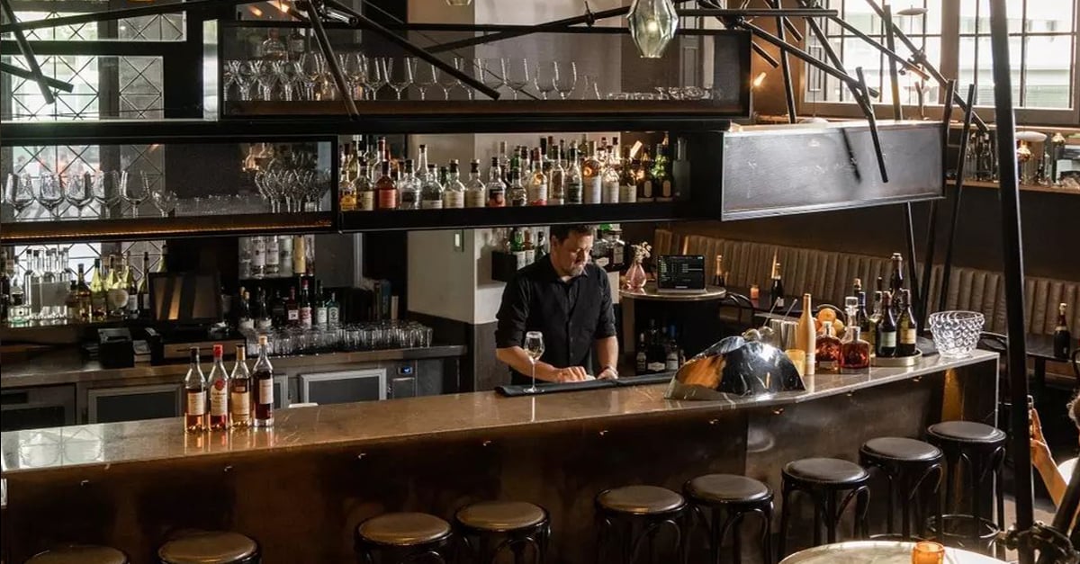 Bar tender behind the bar in a restaurant 