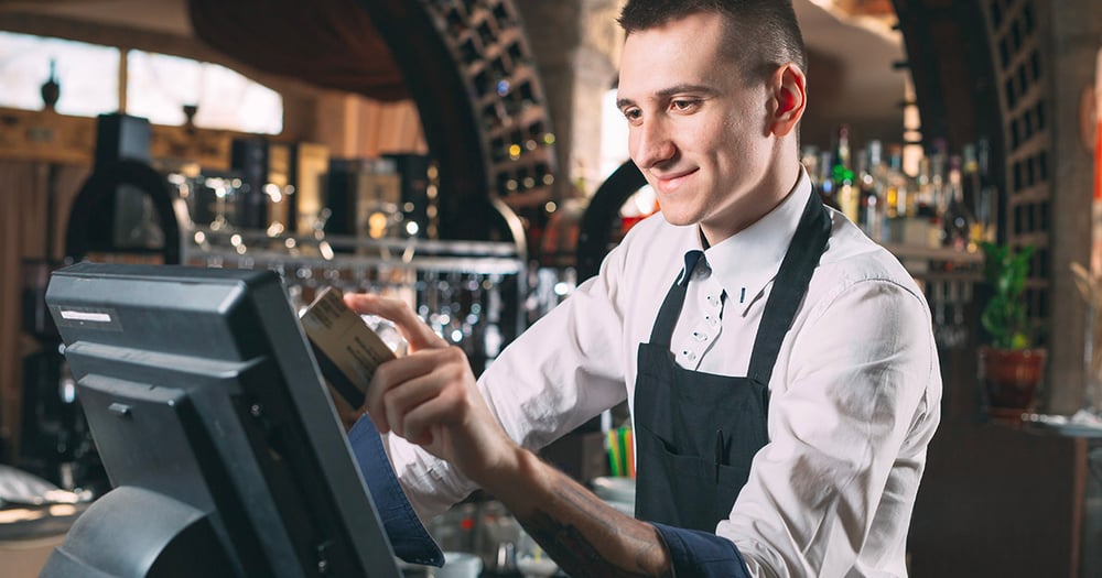 Restaurant staff using a pos system terminal