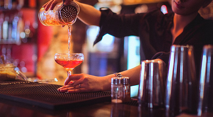 Bar tender mixing a cocktail