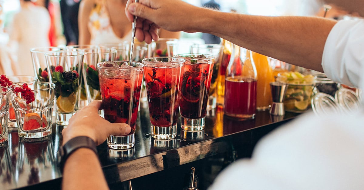 Bar man creating mocktails