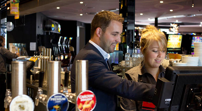 Pub manager and staff member with OrderMate using the POS