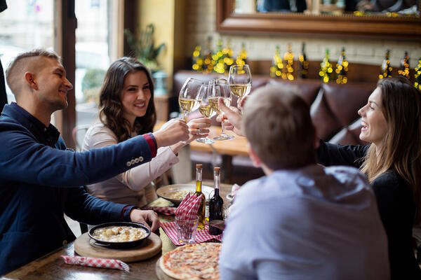 group of friends celebrating at a restaurant