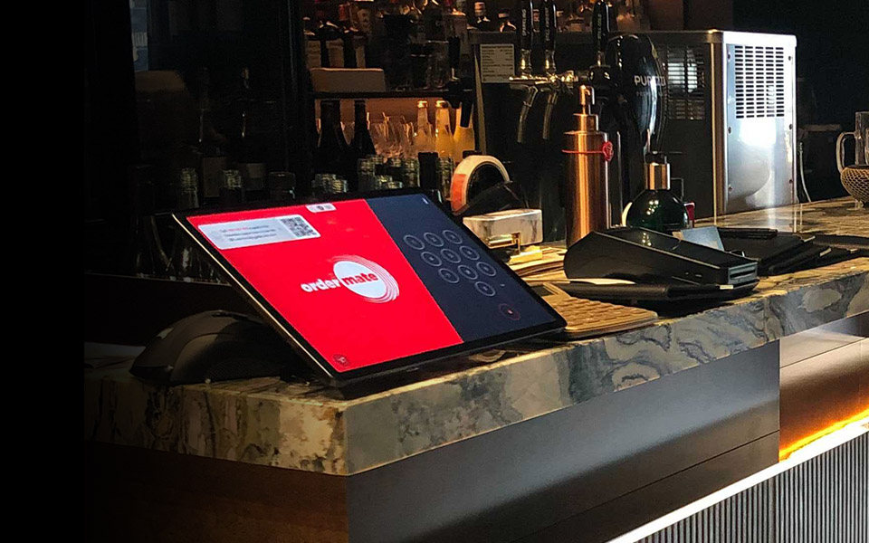 OrderMate POS system on a bar