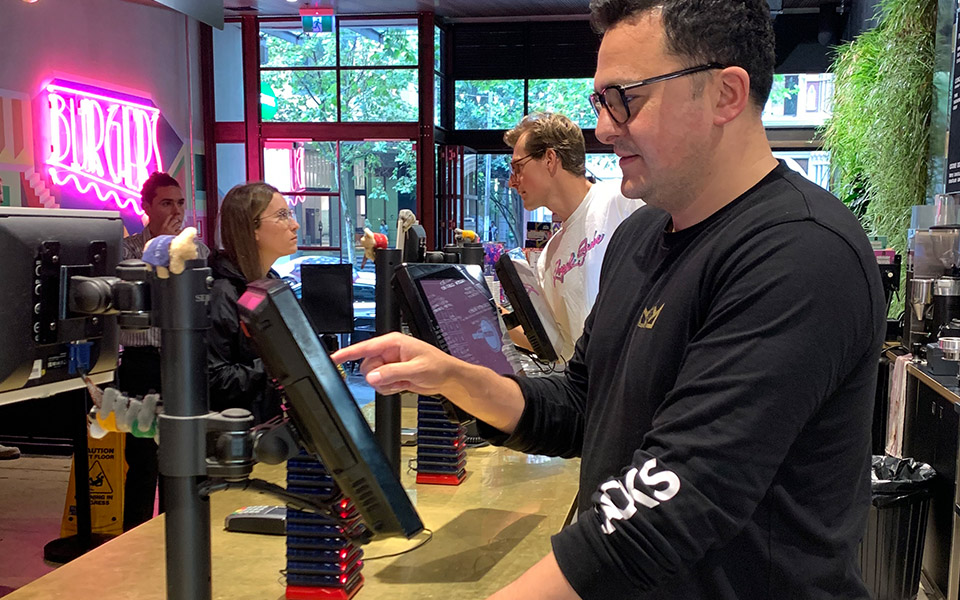 Manager at quick service restaurant using the POS system