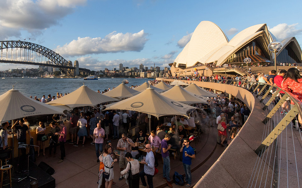 Groups of people at a venue near the Sydney Opera house
