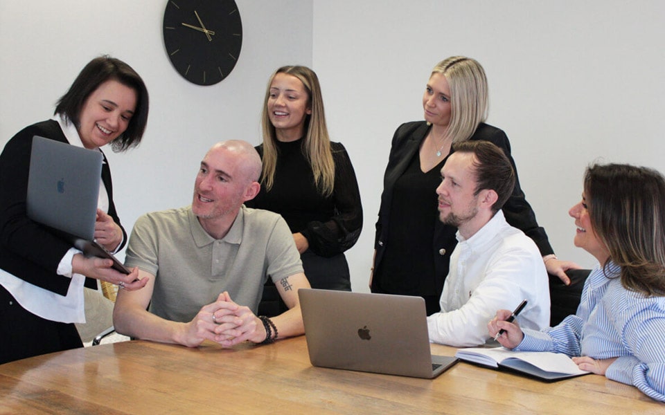 The OrderMate team working around a table