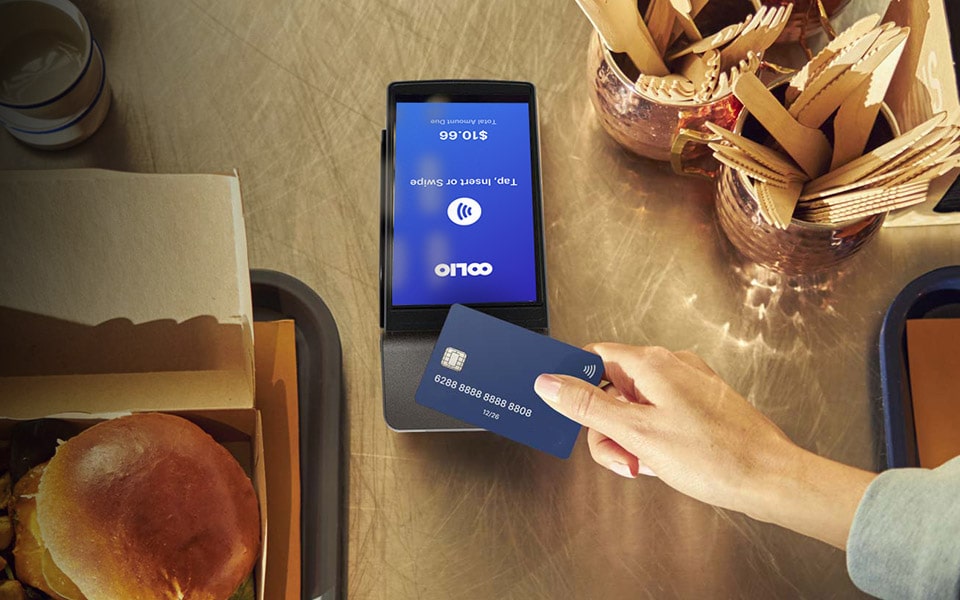 Customer paying by EFTPOS using an Oolio Pay terminal